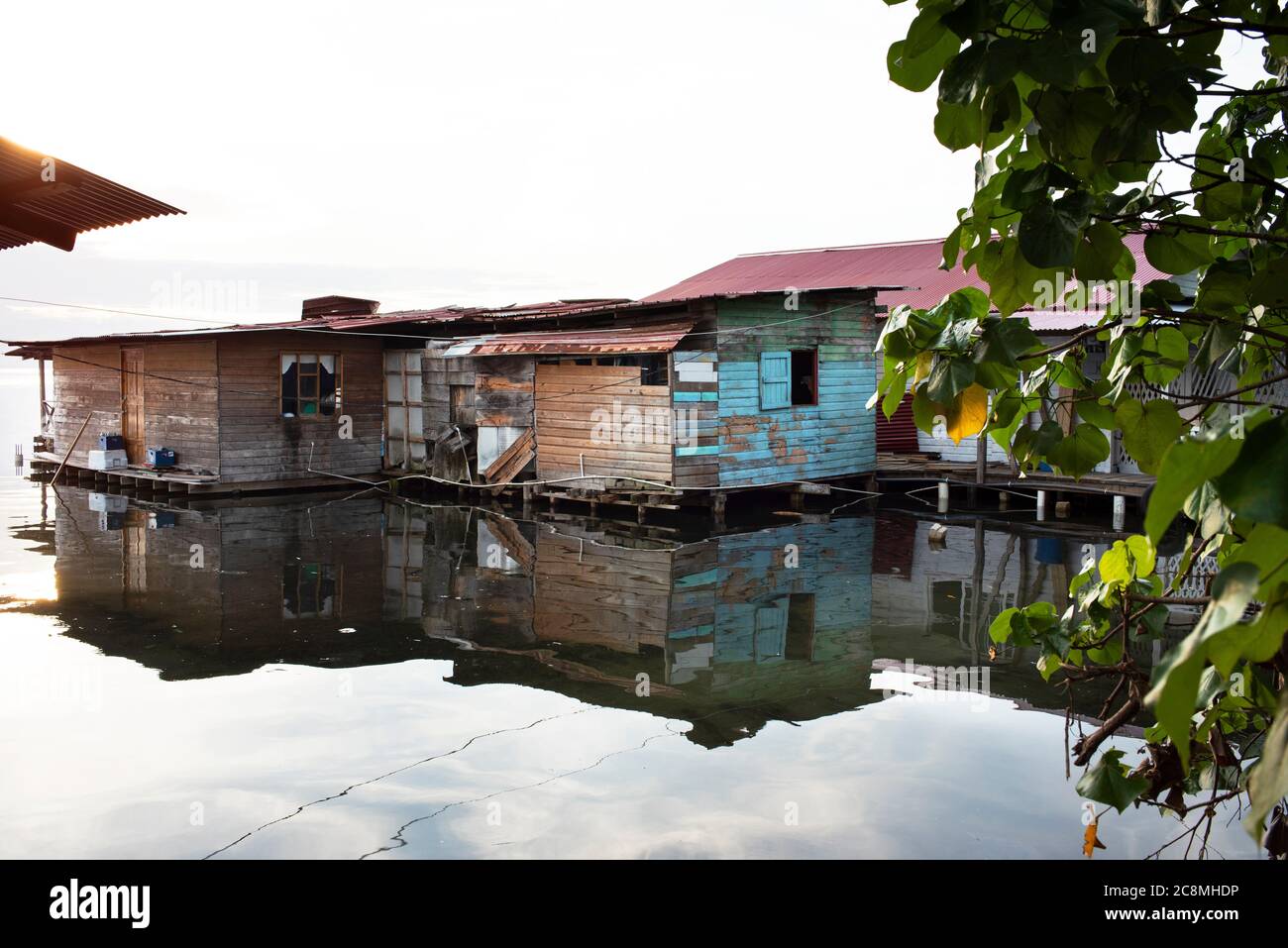 Overwater bungalows and reflections. Residential homes in the Caribbean, Bocas Town, Bocas del Toro, Panama, Oct 2018 Stock Photo