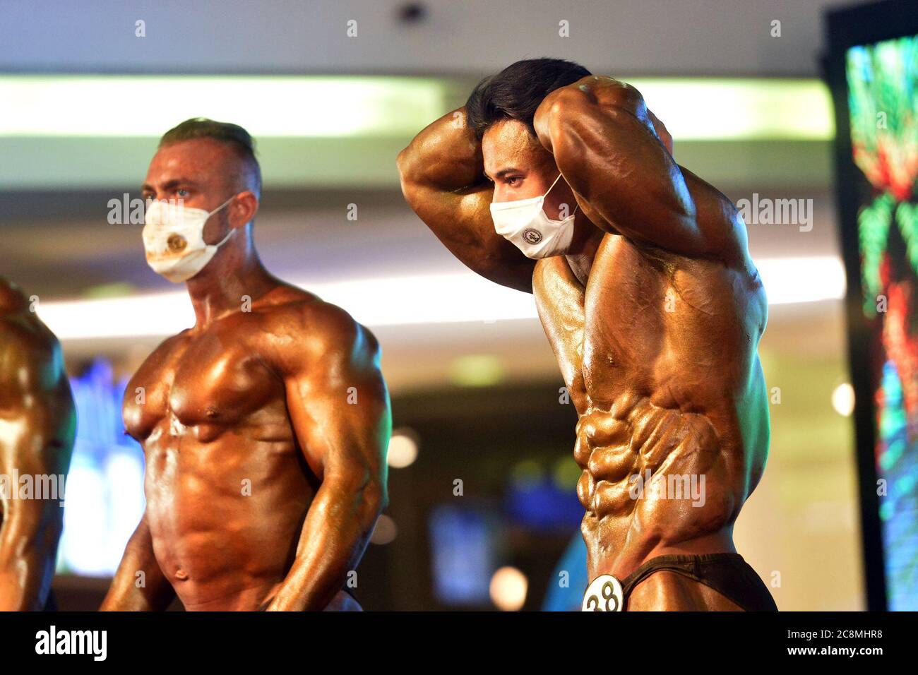 Pattaya, Thailand. 25th July, 2020. Contestants show their muscle