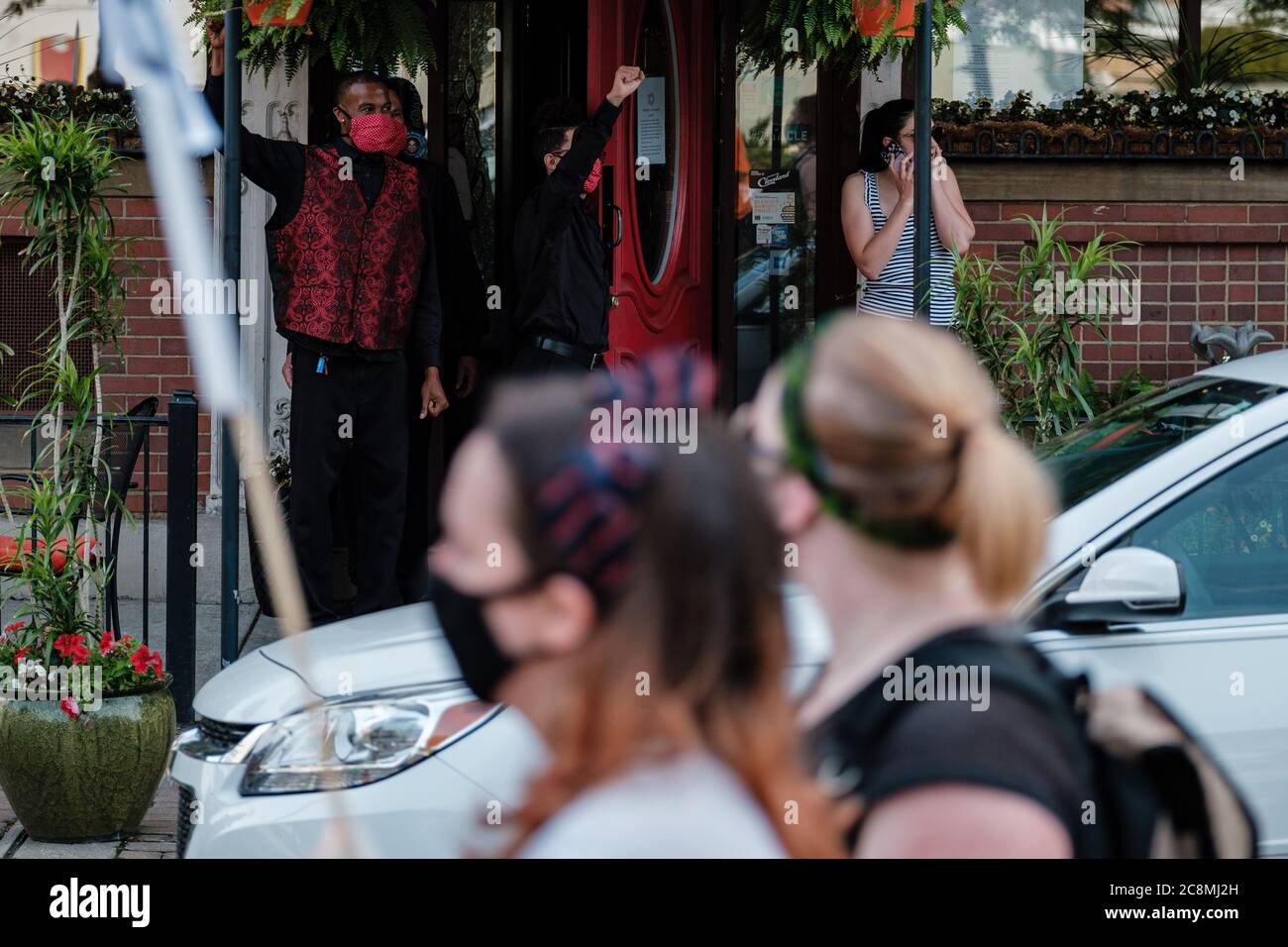 Cleveland, Ohio, USA. 25th July, 2020. Restaurant workers are seen showing solidarity for protestors during a ''No Facist Military War On The People'' protest, Saturday, July 25, 2020 in Cleveland, Ohio. Credit: Andrew Dolph/ZUMA Wire/Alamy Live News Stock Photo