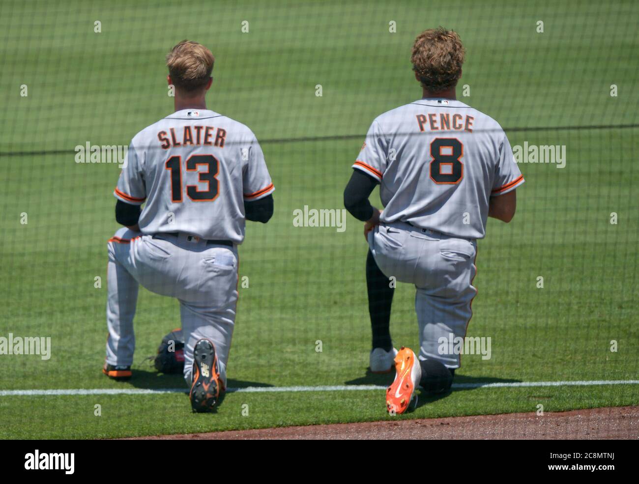 Los Angeles, United States. 26th July, 2020. San Francisco Giants' Austin Slater (13) and Hunter Pence (8) kneel during the National Anthem at Dodger Stadium in Los Angeles on Saturday, July 25, 2020. The Giants defeated the Dodgers 5-4. Photo by Jim Ruymen/UPI Credit: UPI/Alamy Live News Stock Photo