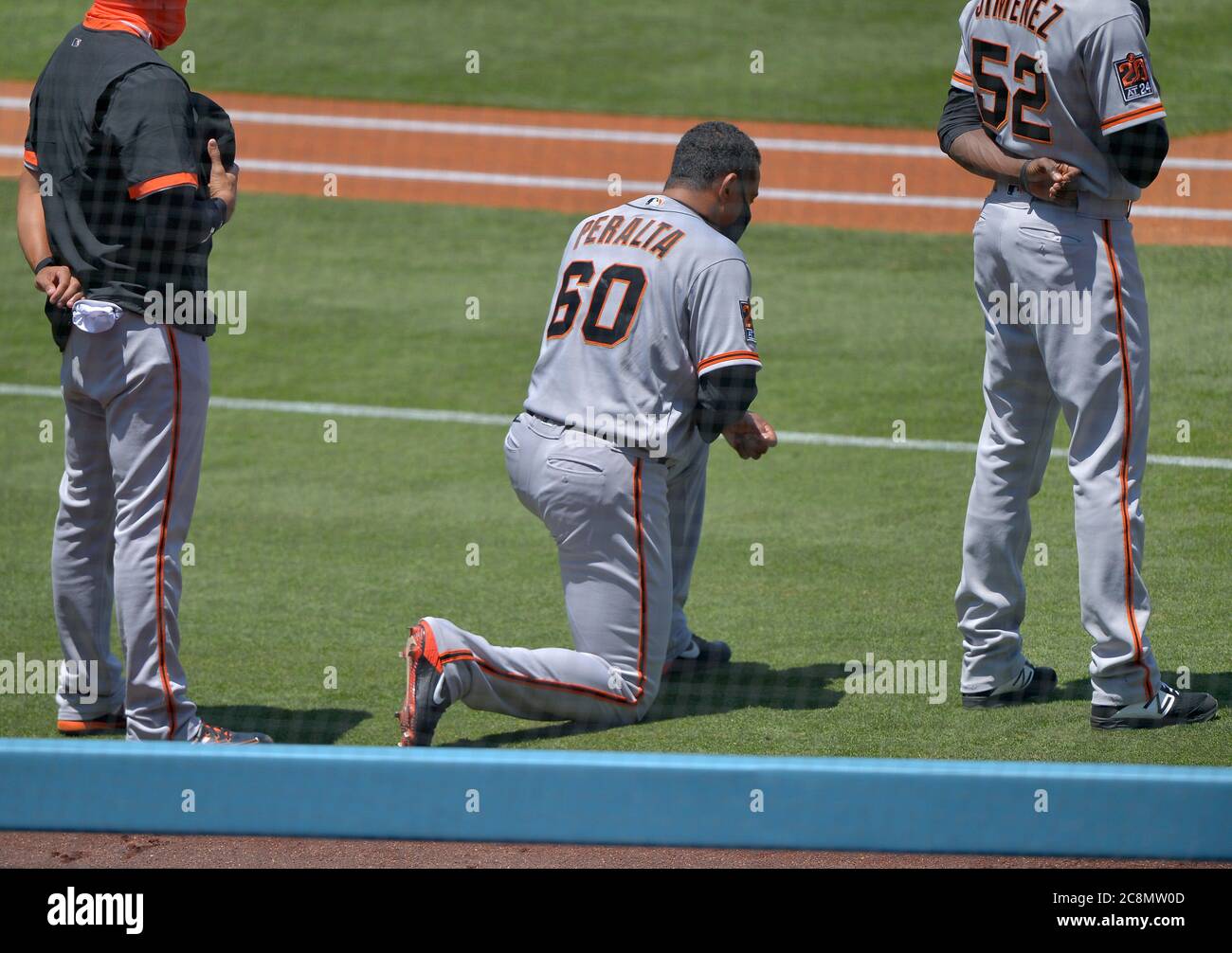 Los Angeles, United States. 26th July, 2020. San Francisco Giants' Wandy Peralta kneels during the National Anthem at Dodger Stadium in Los Angeles on Saturday, July 25, 2020. The Giants defeated the Dodgers 5-4. Photo by Jim Ruymen/UPI Credit: UPI/Alamy Live News Stock Photo