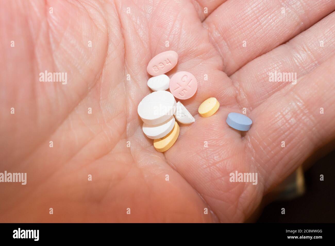 hand holding various pill medications model released (photographers, my hand) Stock Photo