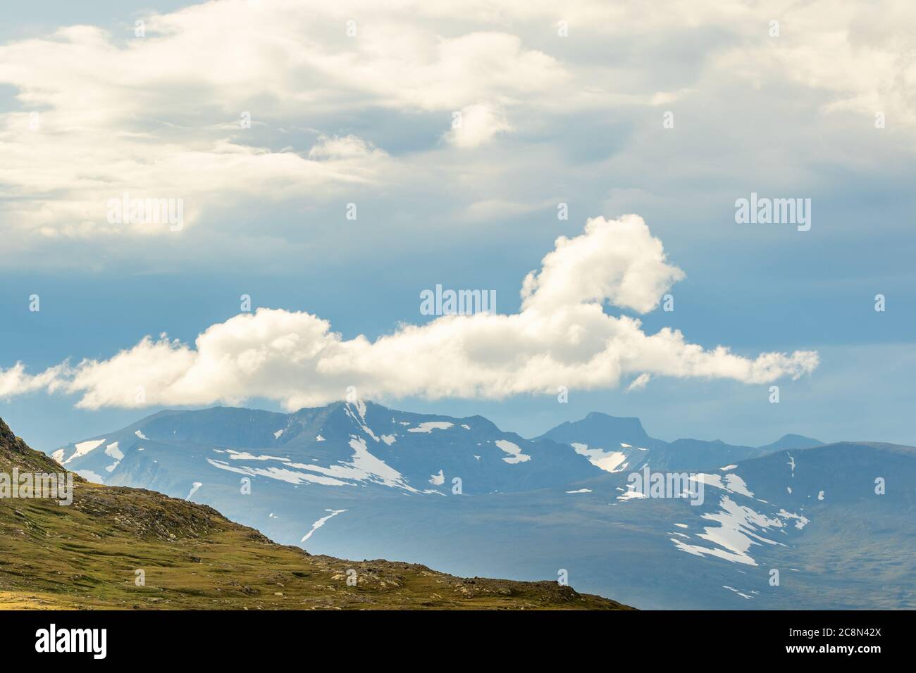 Cloud formation on the sky over a mountain landscape Stock Photo