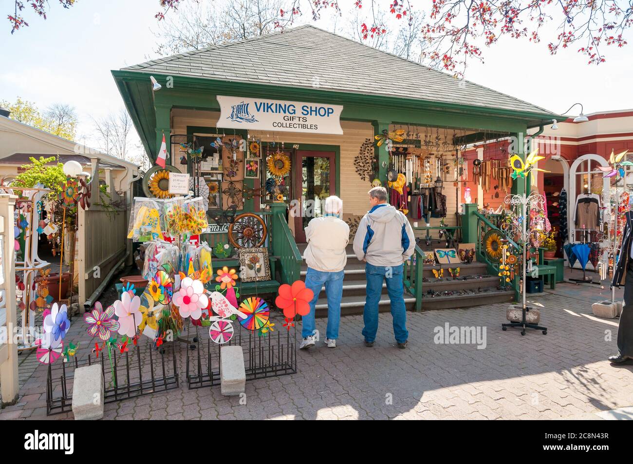 Niagara-on-the-Lake, Ontario, Canada - April 25, 2012: People visiting outdoor market with gifts shop in the center of Niagara-on-the-Lake, Canada Stock Photo