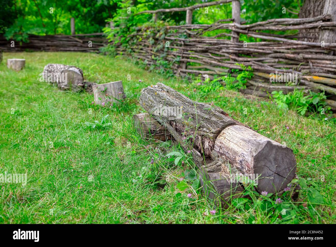 Rustic yard with bench made by log Stock Photo Alamy