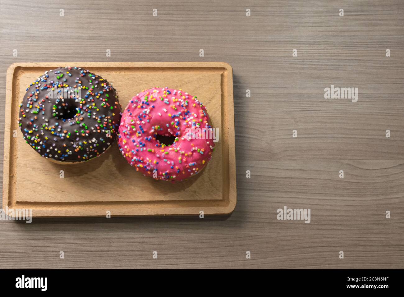 Delicious donuts on wood Stock Photo