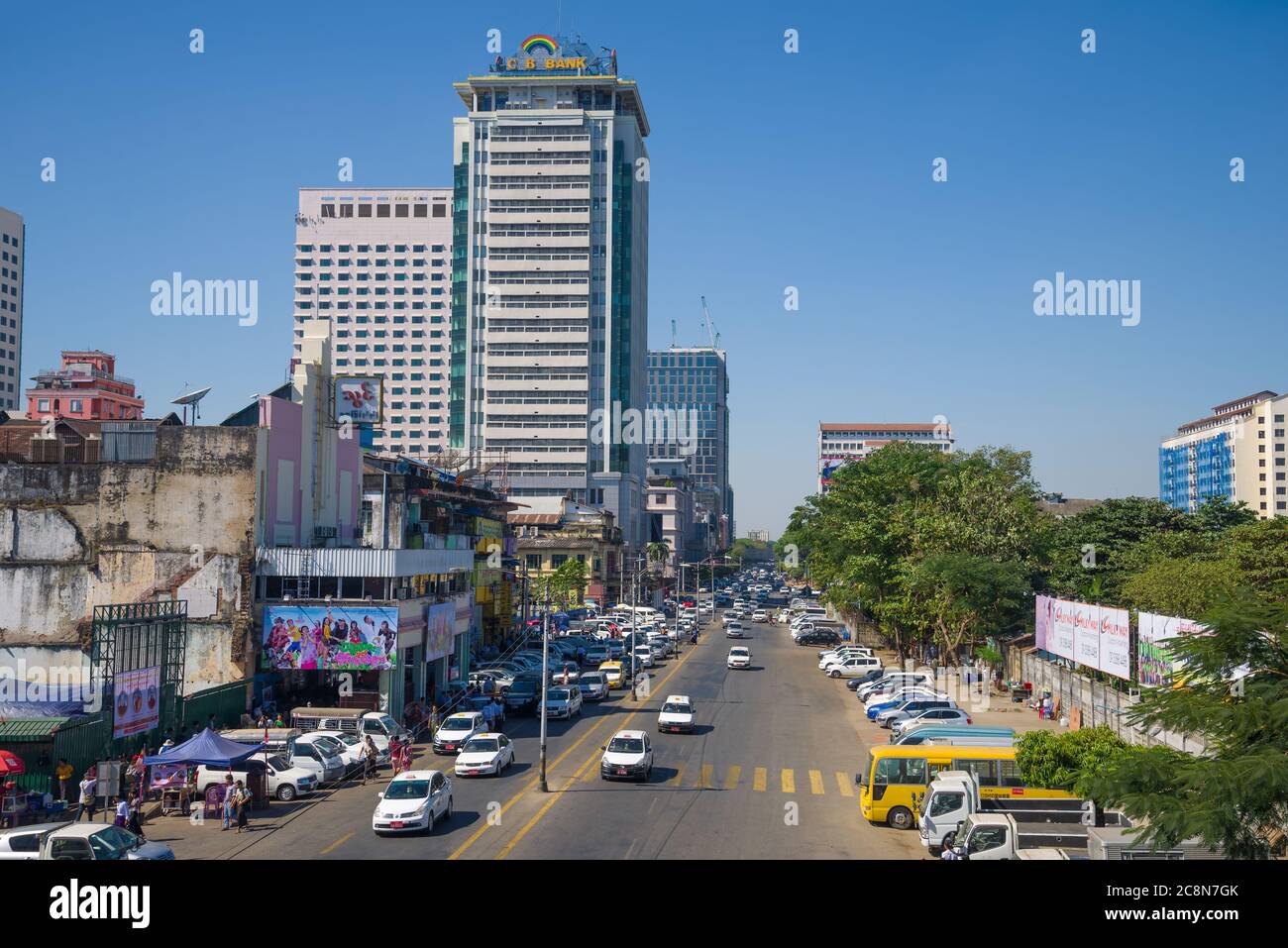 YANGON, MYANMAR - DECEMBER 18, 2016: Urban street in modern Yangon Stock Photo