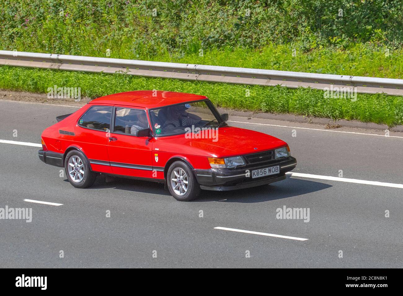 1992 RED Saab 900 S Turbo; Vehicular traffic moving vehicles, cars driving vehicle on UK roads, motors, motoring on the M6 motorway highway network. Stock Photo