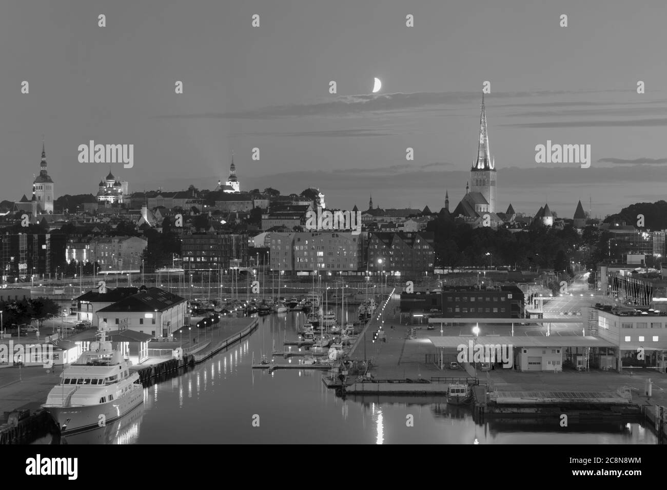 Tallinn, Estonia - July 29, 2017: Night cityscape of Estonian capital city viewed from the port. Black and wight image Stock Photo