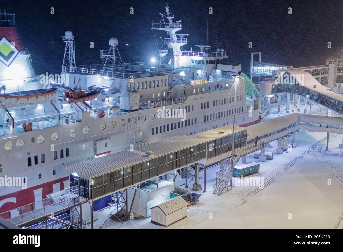 Winter cruise: MS Rosella, a cruise ferry ship operated by Viking Line, in the port of Mariehamn, Åland Islands, Finland, under night snow storm Stock Photo