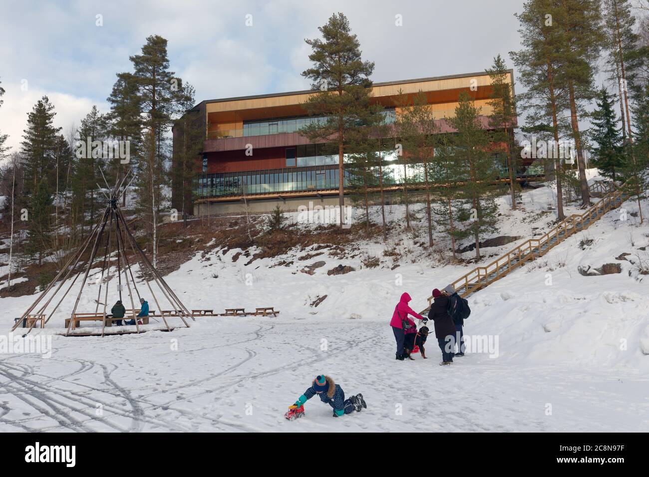 Family with kids and dog resting at the Finnish Nature Center Haltia, located in Nuuksio national park near Helsinki, Finland Stock Photo