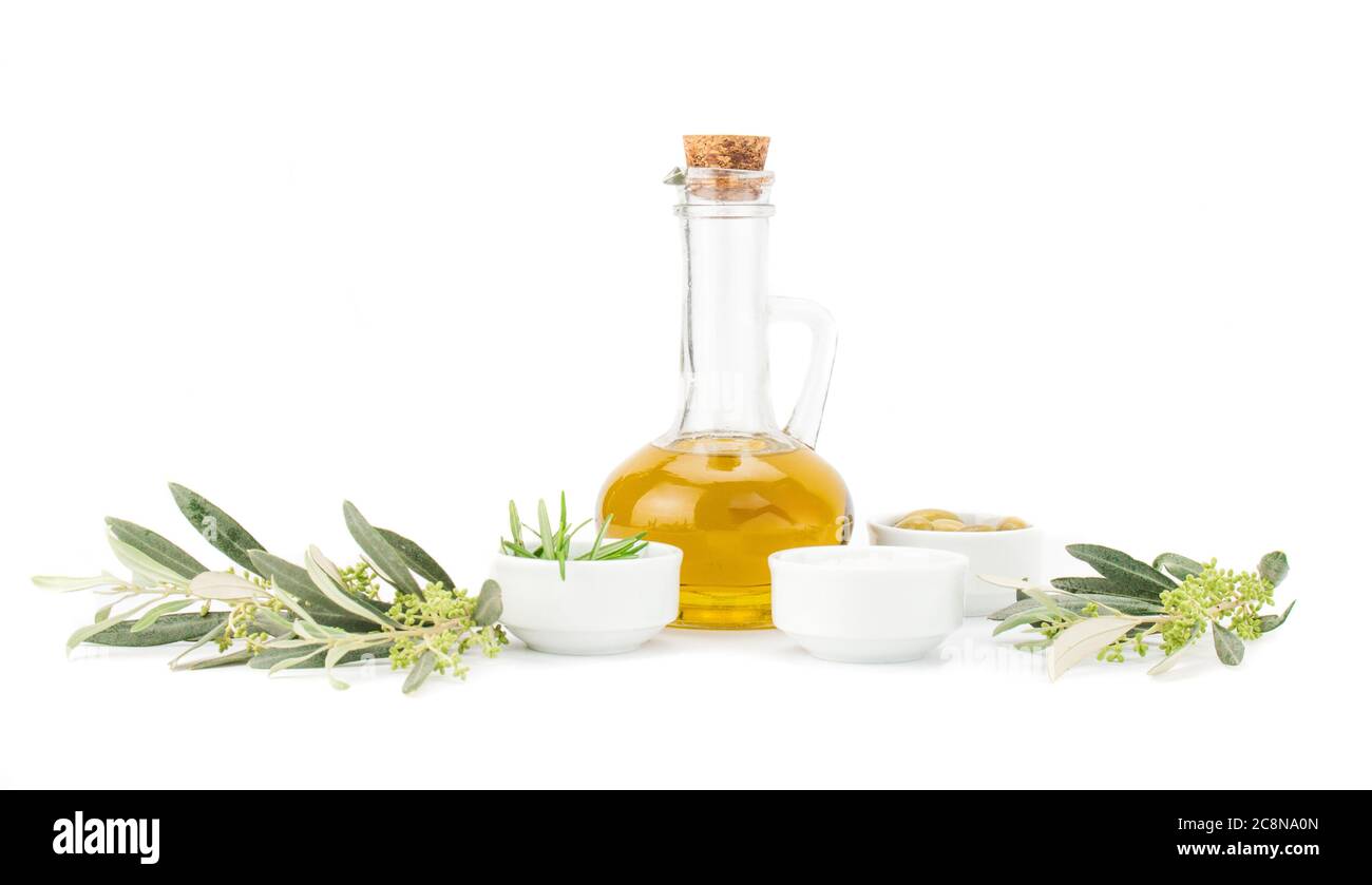 Glass bottle of premium virgin olive oil, lemon and some olives with ...