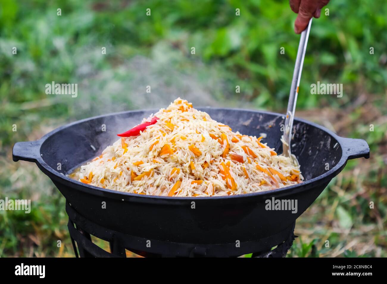 Cooked Food In A Large Cast-iron Pot Stock Photo, Picture and