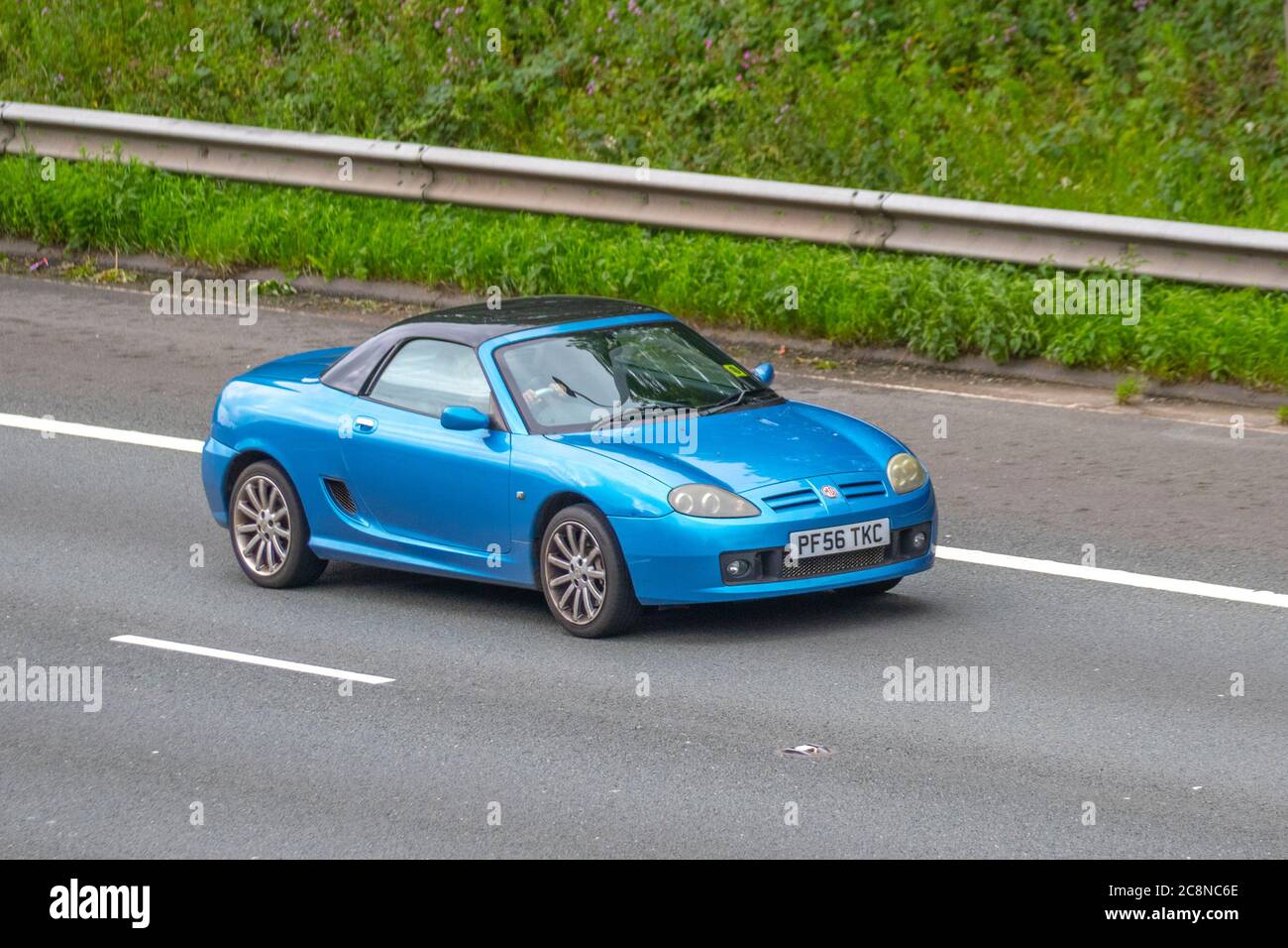 2007 MG MG TF Spark 135; Vehicular traffic moving vehicles, sportscars driving vehicle on UK roads, motors, motoring on the M6 motorway highway network. Stock Photo