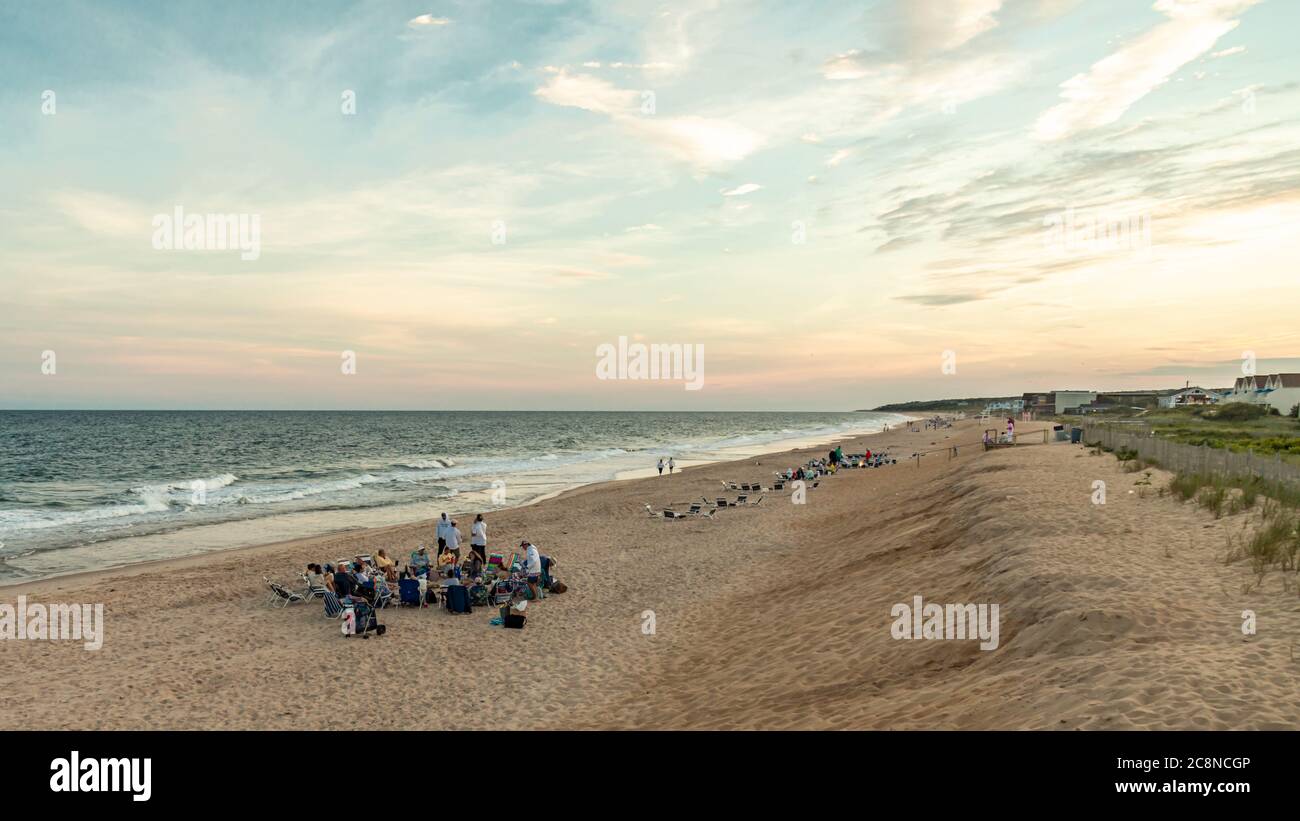 Groups of people with beach bonfires on the beach in Montauk, NY Stock Photo