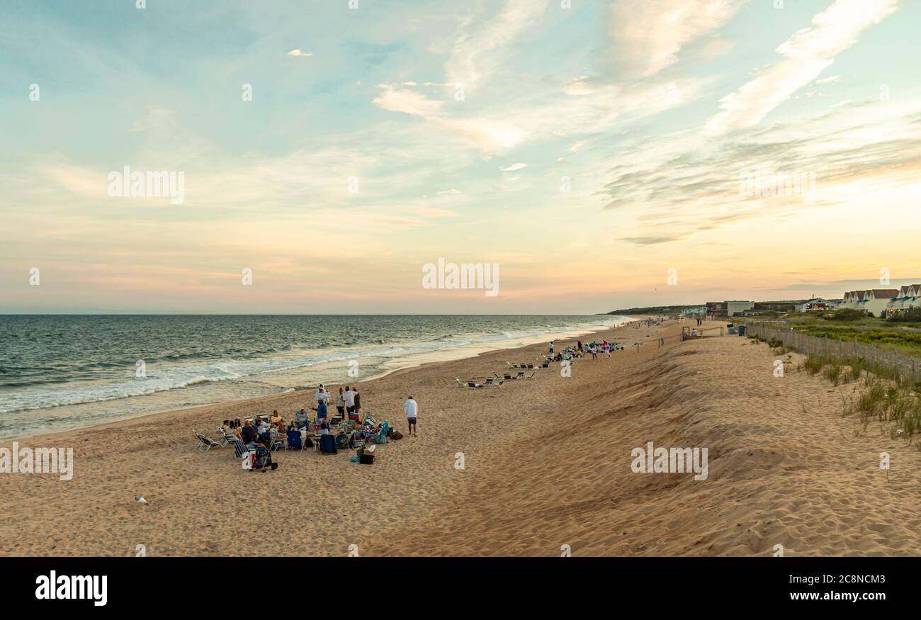 Groups of people with beach bonfires on the beach in Montauk, NY Stock Photo