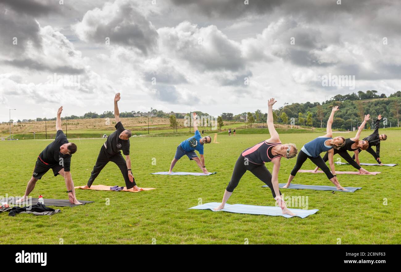 Cork City, Cork, Ireland. 26th July, 2020. Participants taking part in an outdoor fundraising yoga class  that was run by Yoga Republic with proceeds in aid of Dog Action Welfare at  Tramore Valley Park, Cork, Ireland.   - Credit; David Creedon / Alamy Live News Stock Photo