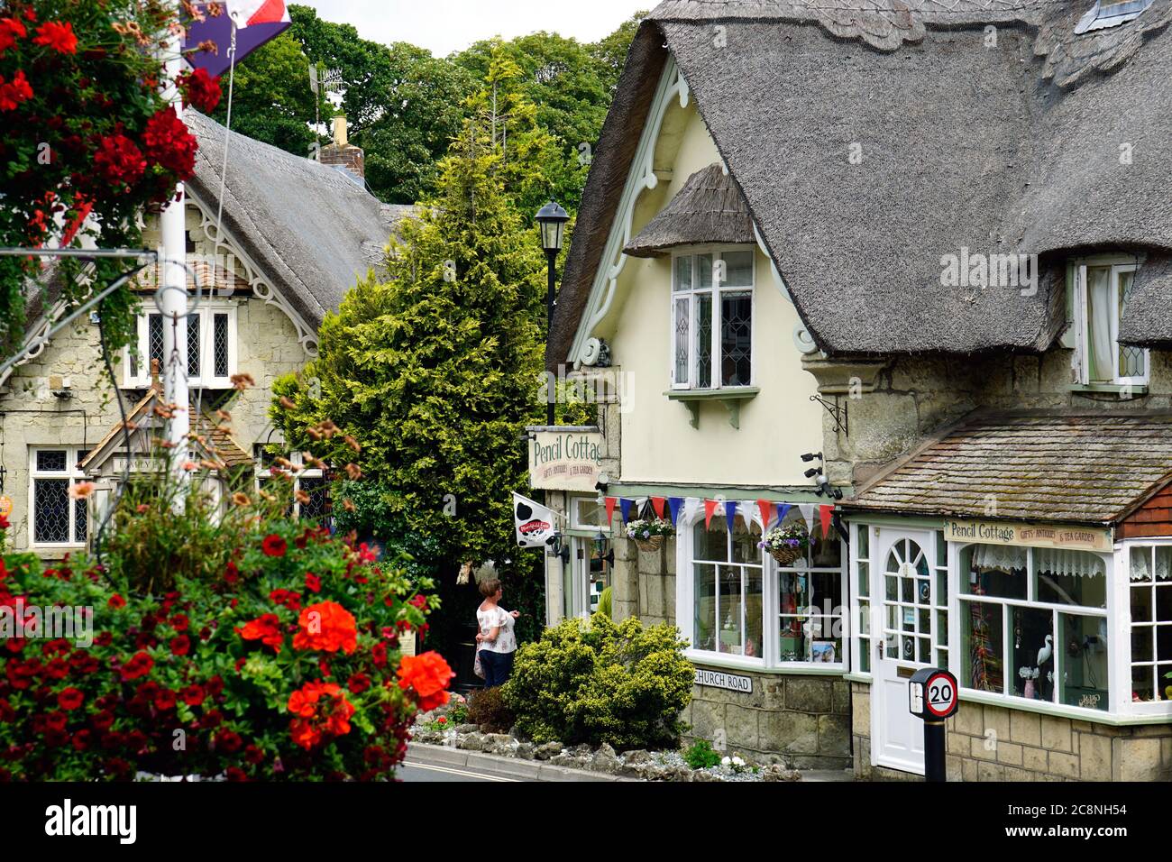 Shanklin, Isle of Wight, UK. July 14, 2020.  Tourst queue under coronavirus rule to enter Pencil cottage in the beautiful thatched village of Shanklin. Stock Photo
