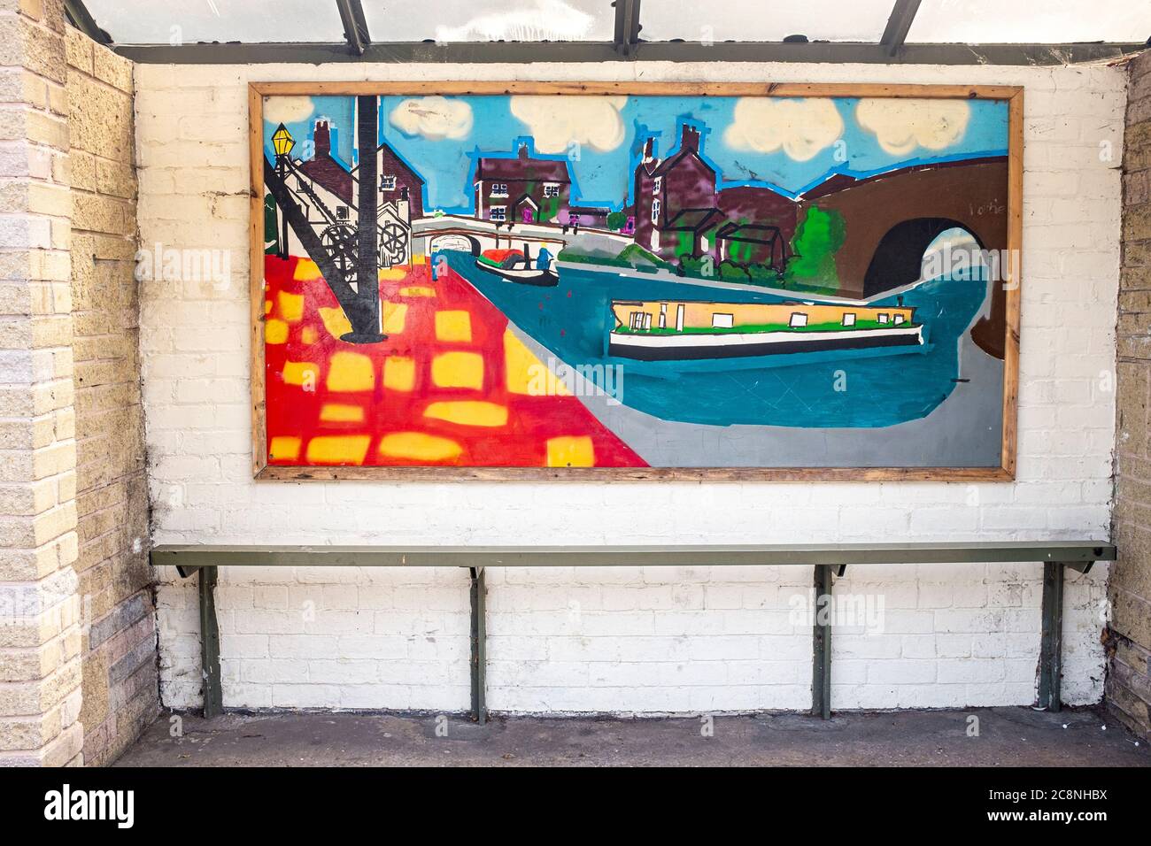 Painting of local architecture with narrow boats inside bus shelter in