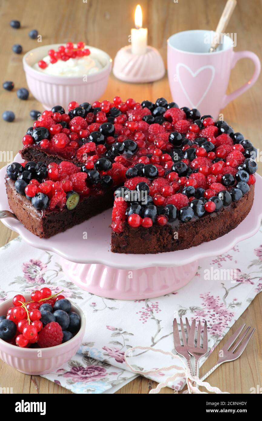 chocolate cake with mixed berries on cake plate Stock Photo