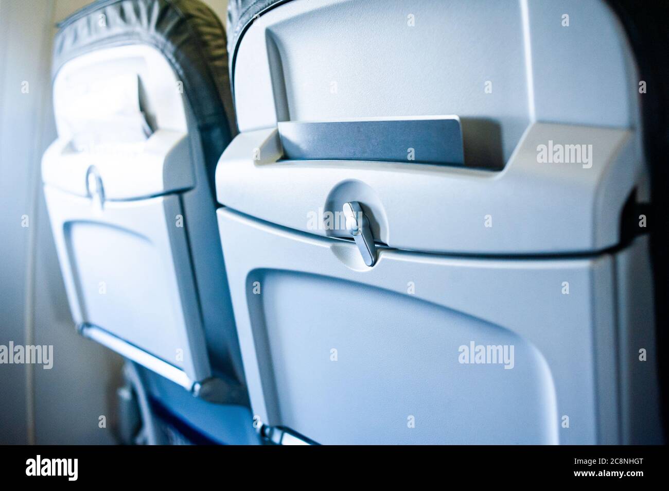 Airplane seats closeup in blue tones Stock Photo