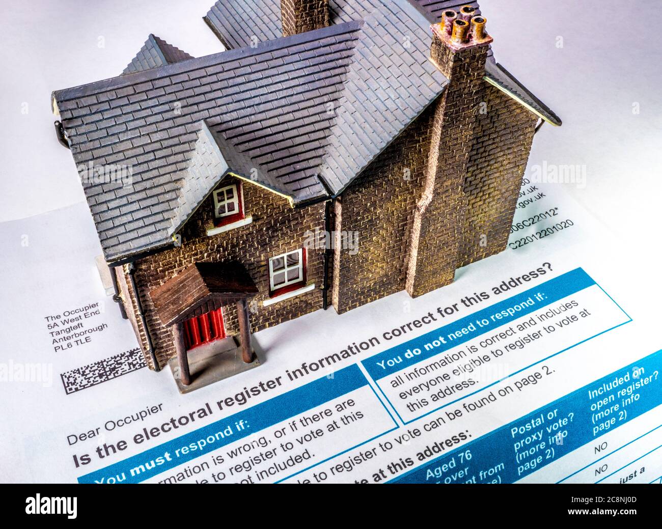 Model house on a council form, sent to the occupier of a home to to check accuracy of occupants / residents for electoral registration purposes (UK). Stock Photo