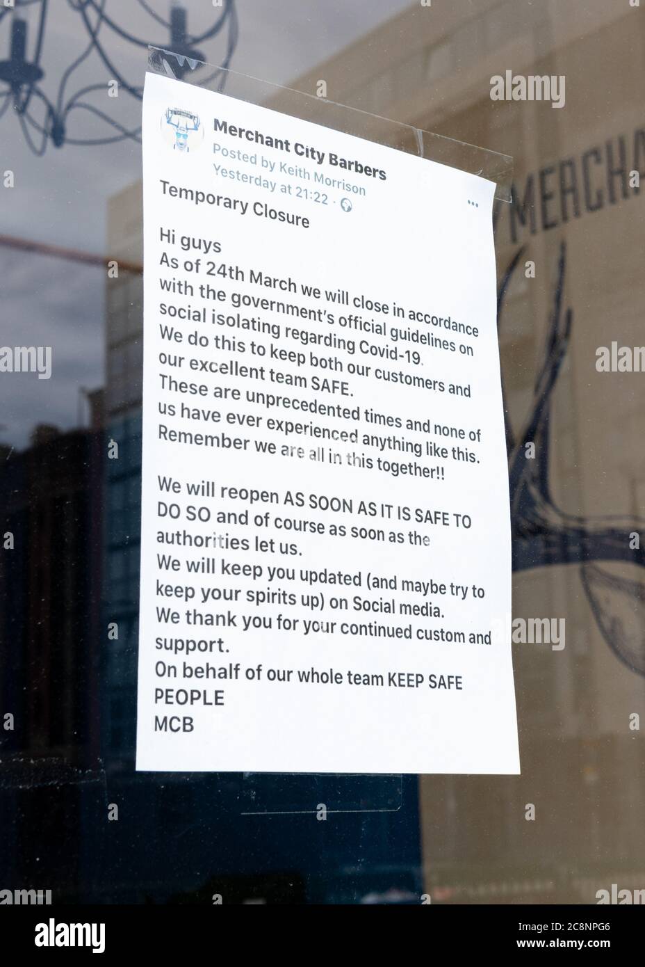 sign dated 24 March 2020 (first day of coronavirus lockdown in Scotland, UK) in window of closed Merchant City Barbers, Glasgow, Scotland, UK Stock Photo