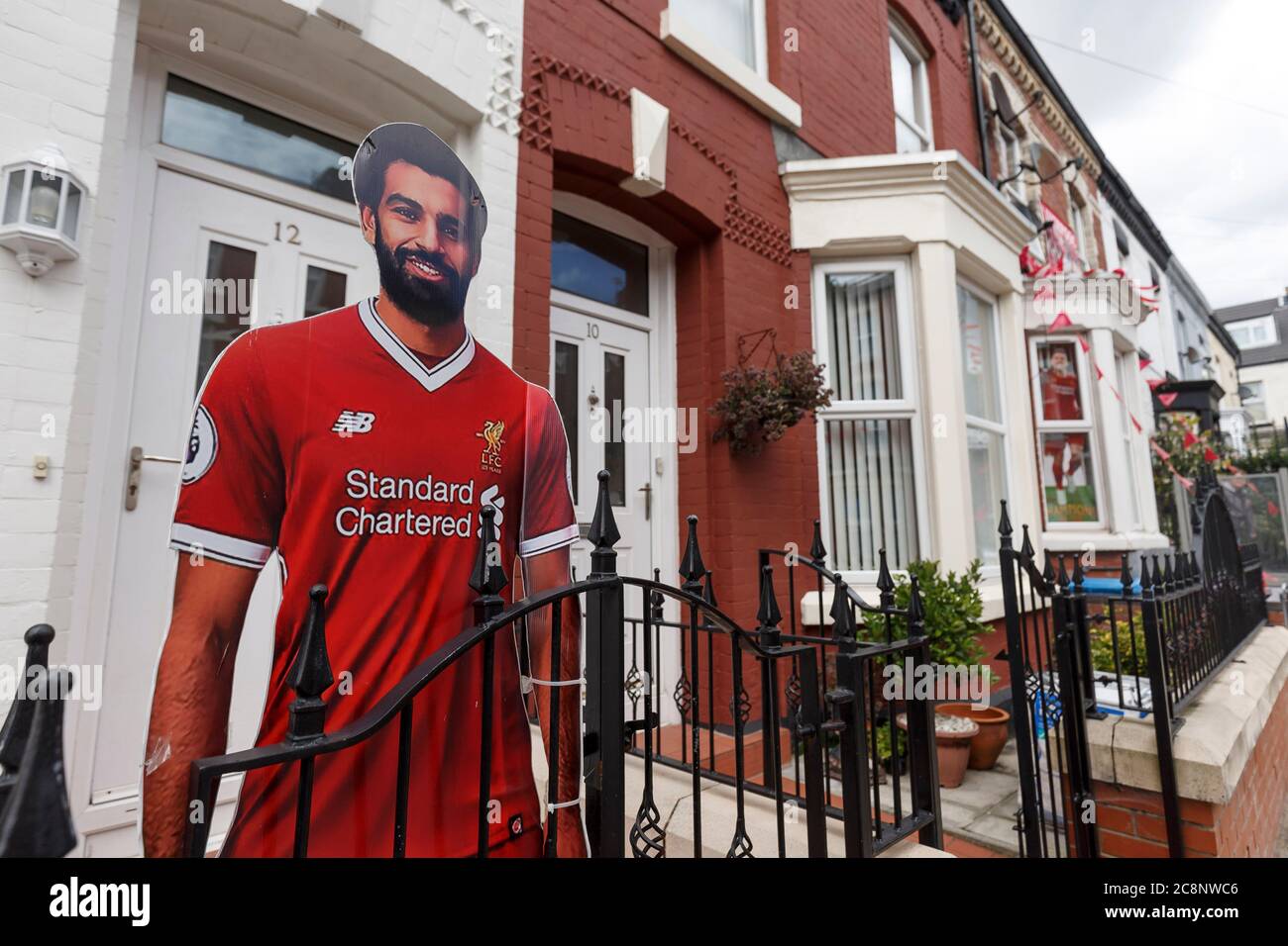 Liverpool, UK. 26th July, 2020. A house is decorated with a cardboard cutout of Mo Salah near a