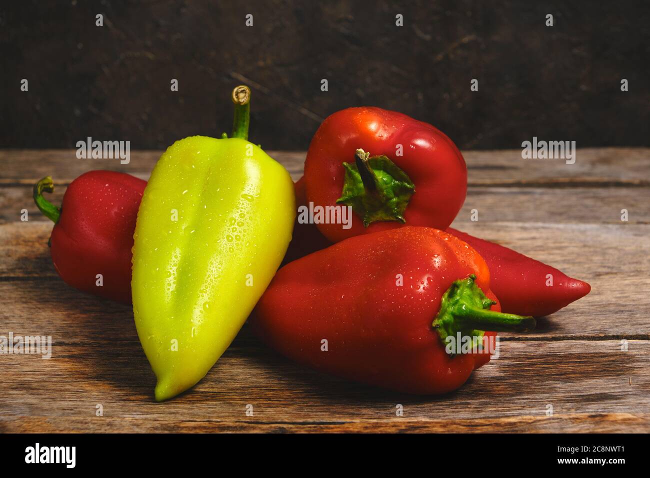 Sweet bell peppers on an old wooden table in a rustic style Stock Photo ...