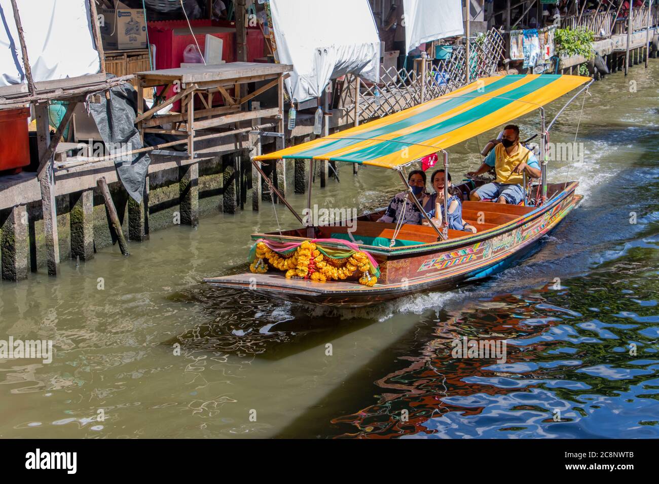 BANGKOK, THAILAND, JUN 20 2020, A boat traffic on the water canal at Khlong Lat Mayom Floating Market. Stock Photo