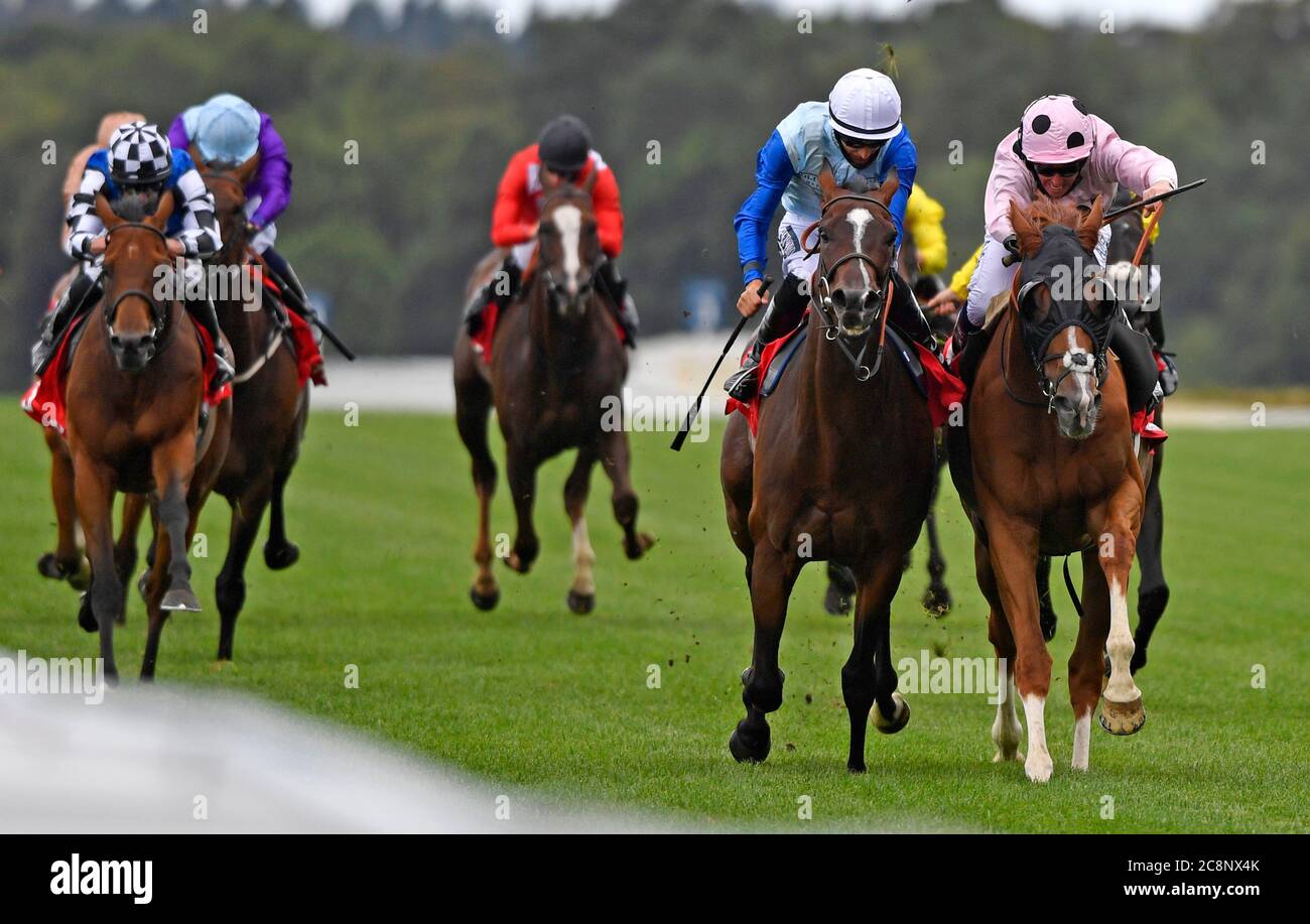 Jeremiah ridden by jockey Jim Crowley (right) beats Sam Cooke ridden by jockey Harry Bentley to win the Betfred 'Fred's Pushes' Handicap Stakes at Ascot Racecourse. Stock Photo