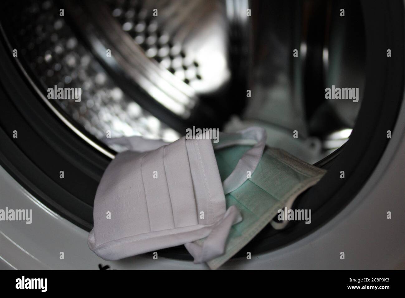 Dirty mouth protection in the washing machine Stock Photo