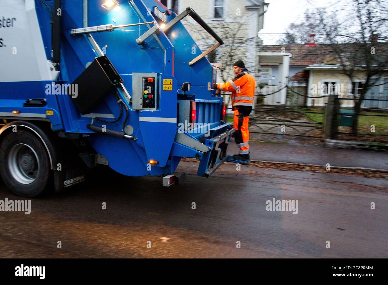 A waste collector, also known as a dustman, binman (in the UK