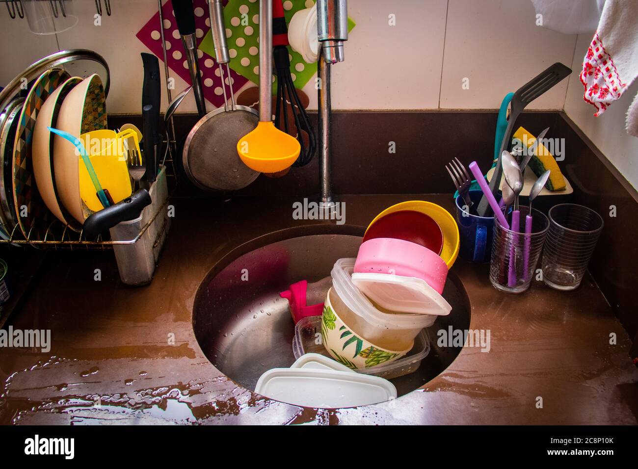 Dirty dishes in a kitchen sink Stock Photo