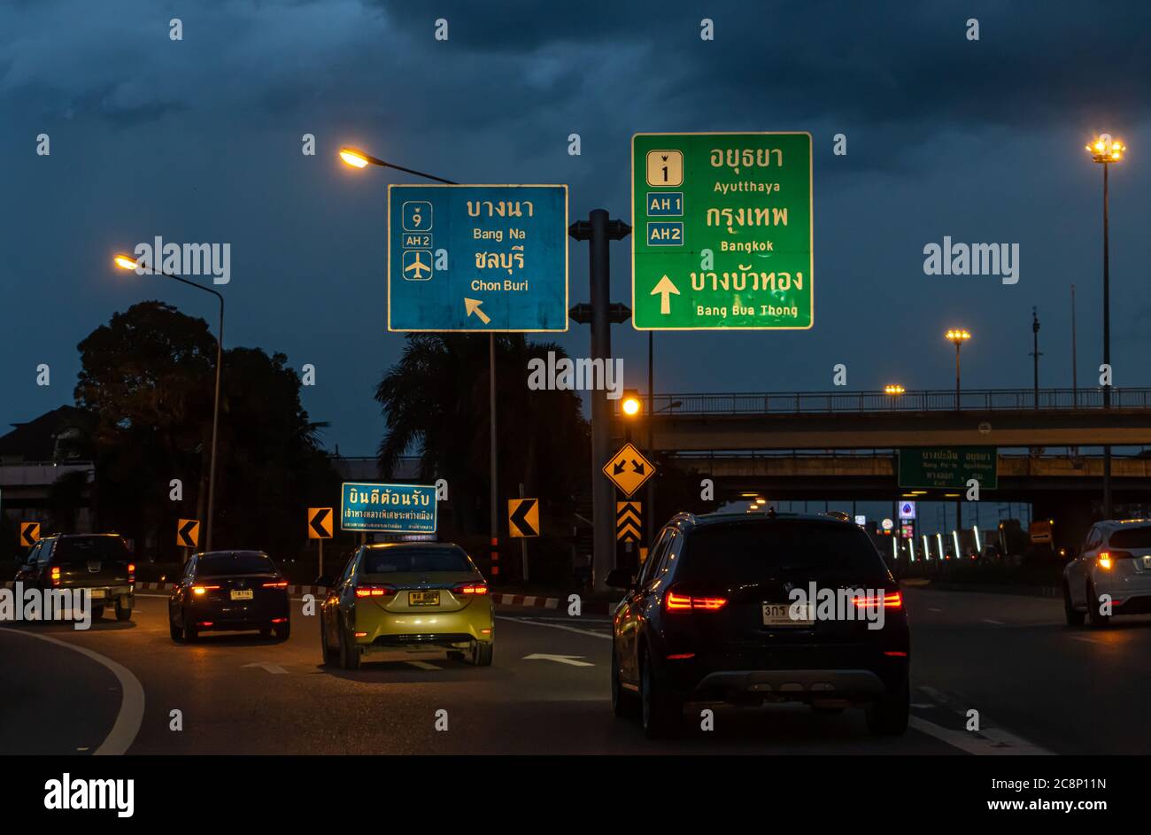 THAILAND, JUN 03 2020, The cars go to the turnoff from the highway. Evening traffic on the motorway. Stock Photo