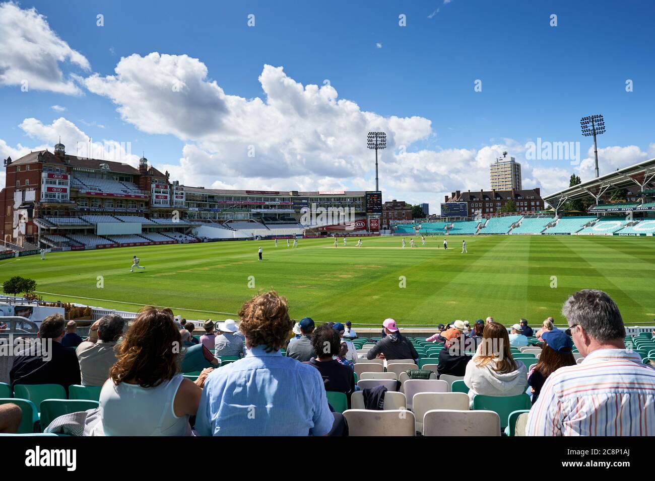 Spectators watch the action from the stands during the friendly match