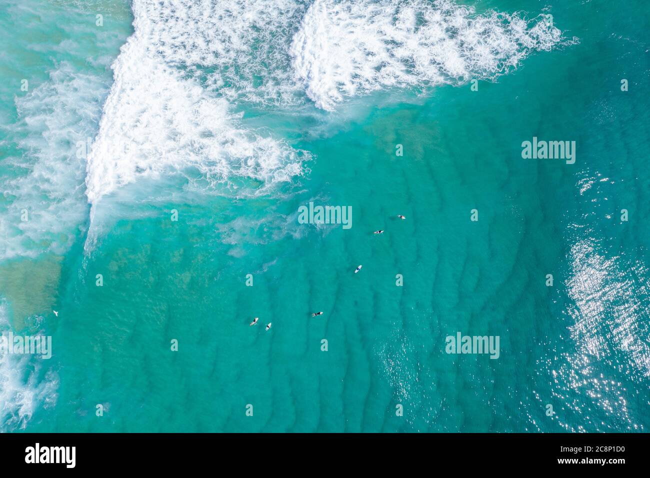 Aerial view of a group of surfers, North Stradbroke Island, Moreton Bay, Queensland, Australia Stock Photo