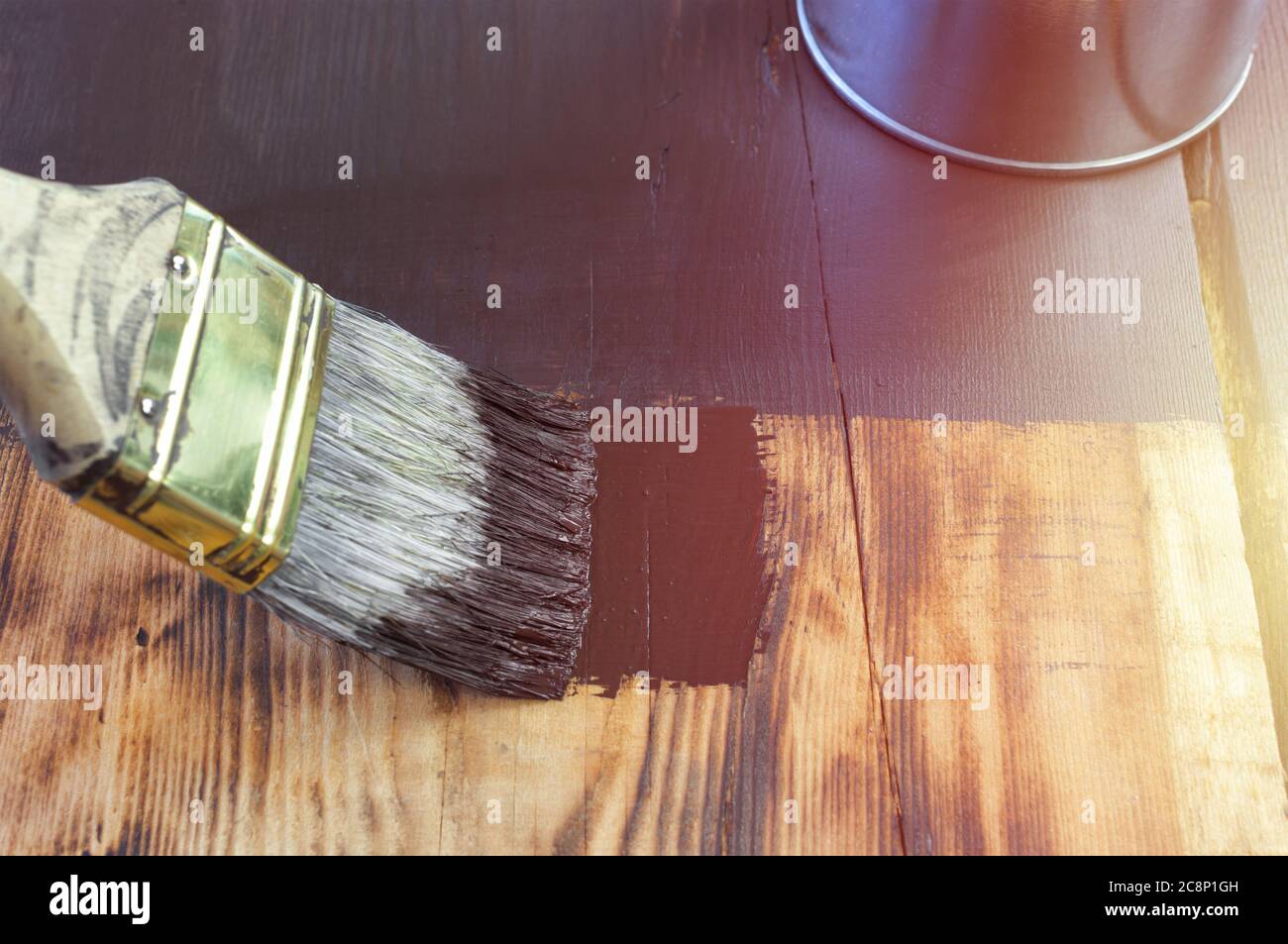 Paint brush on wooden surface Stock Photo