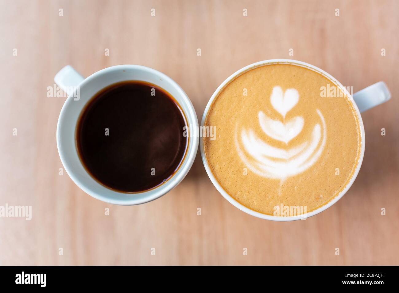 Two cups of coffee, different choice black or white, espresso or