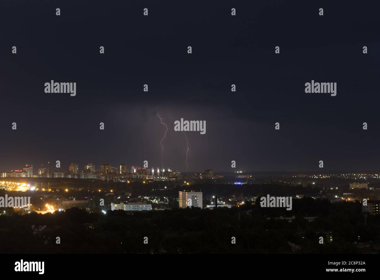 Two lightning flashes in the sky above the city. Background Stock Photo ...