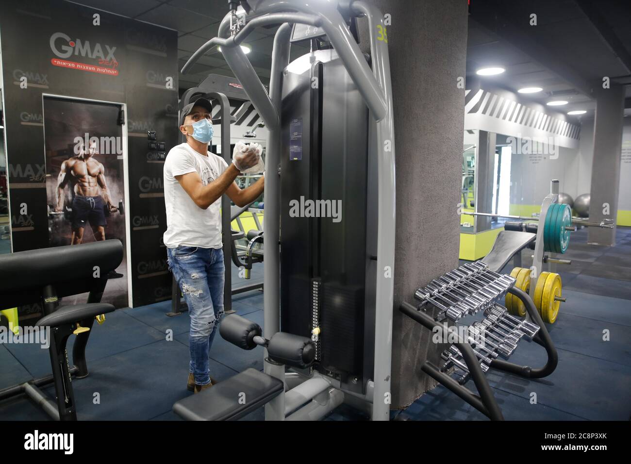 Modiin. 26th July, 2020. An employee disinfects sports facilities at a reopened gym in central Israeli city of Modiin on July 26, 2020. Credit: Gil Cohen Magen/Xinhua/Alamy Live News Stock Photo