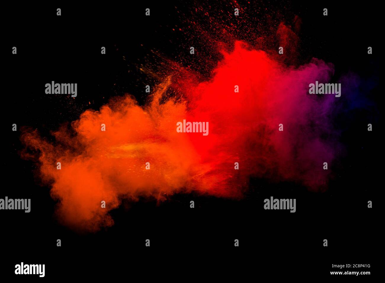 Abstract blurred motion of colorful dust particles on black background.Abstract hot tone color powder overlay texture. Stock Photo
