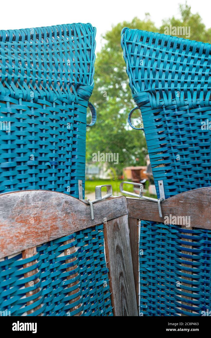 Two typical german blue roofed wicker beach chairs Stock Photo Alamy