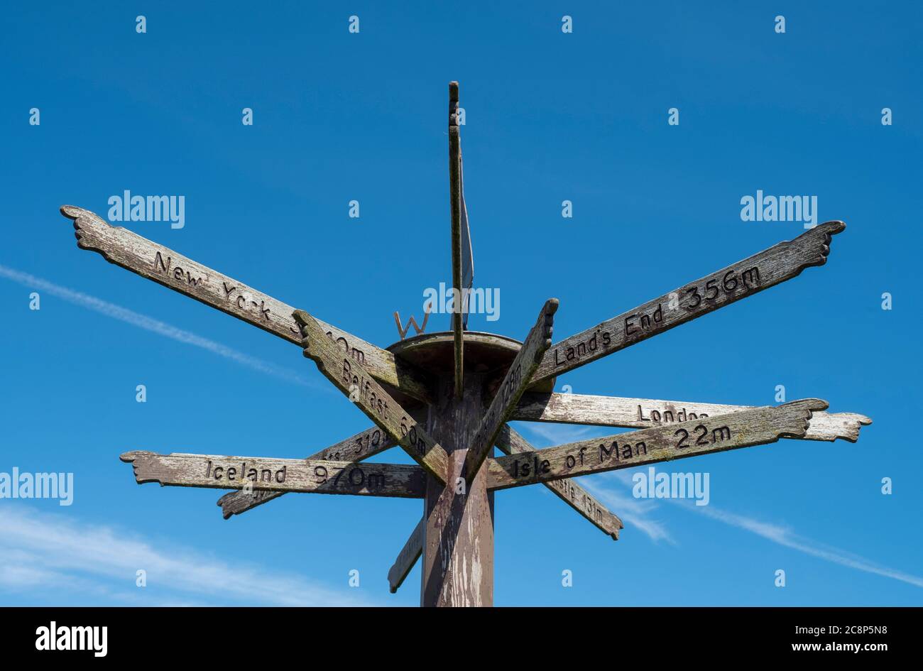 Signpost and weather vane on the seafront at Port William, Dumfries & Galloway, Scotland, UK. Stock Photo