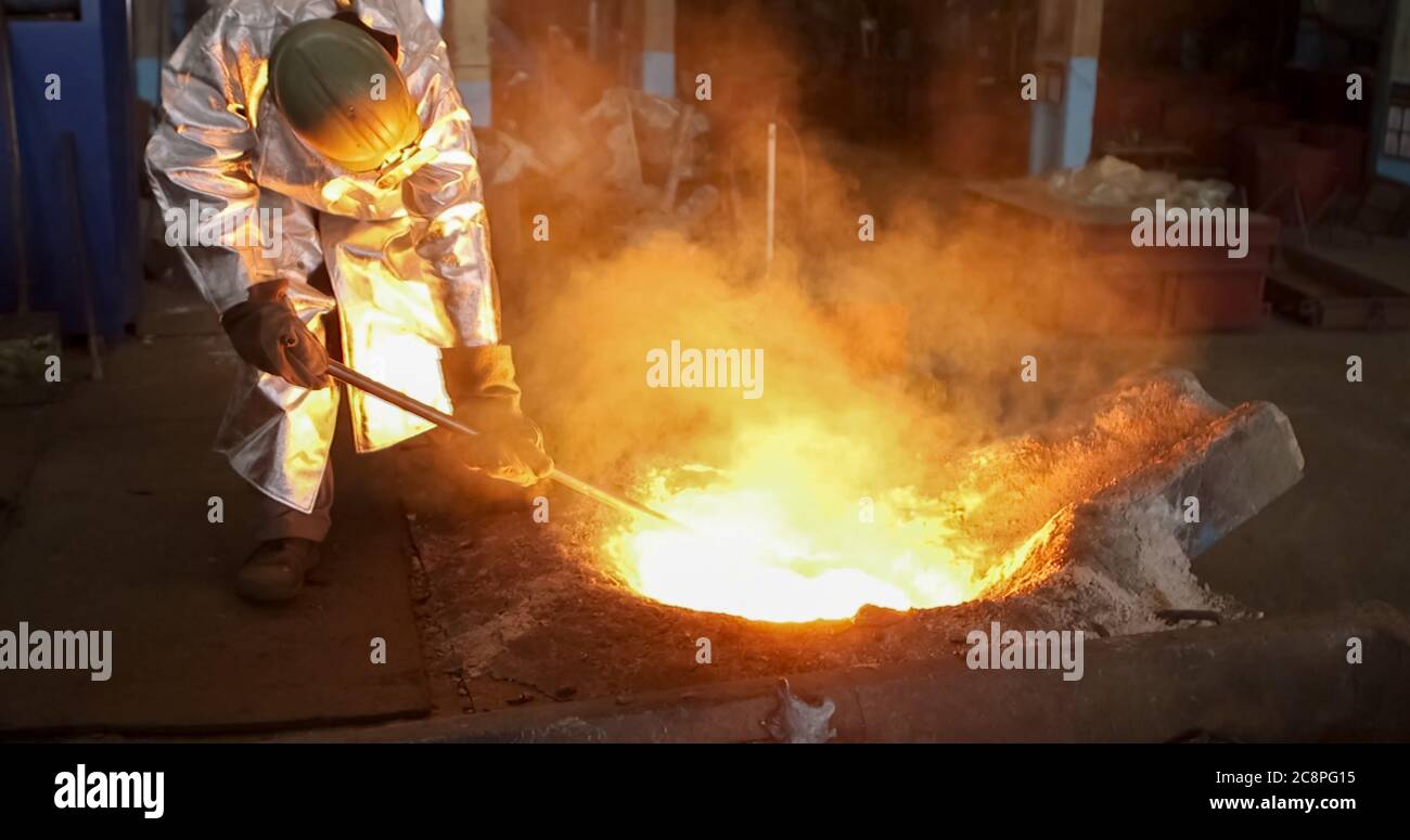 red-hot molten steel in a iron and steel enterprise production scene ...