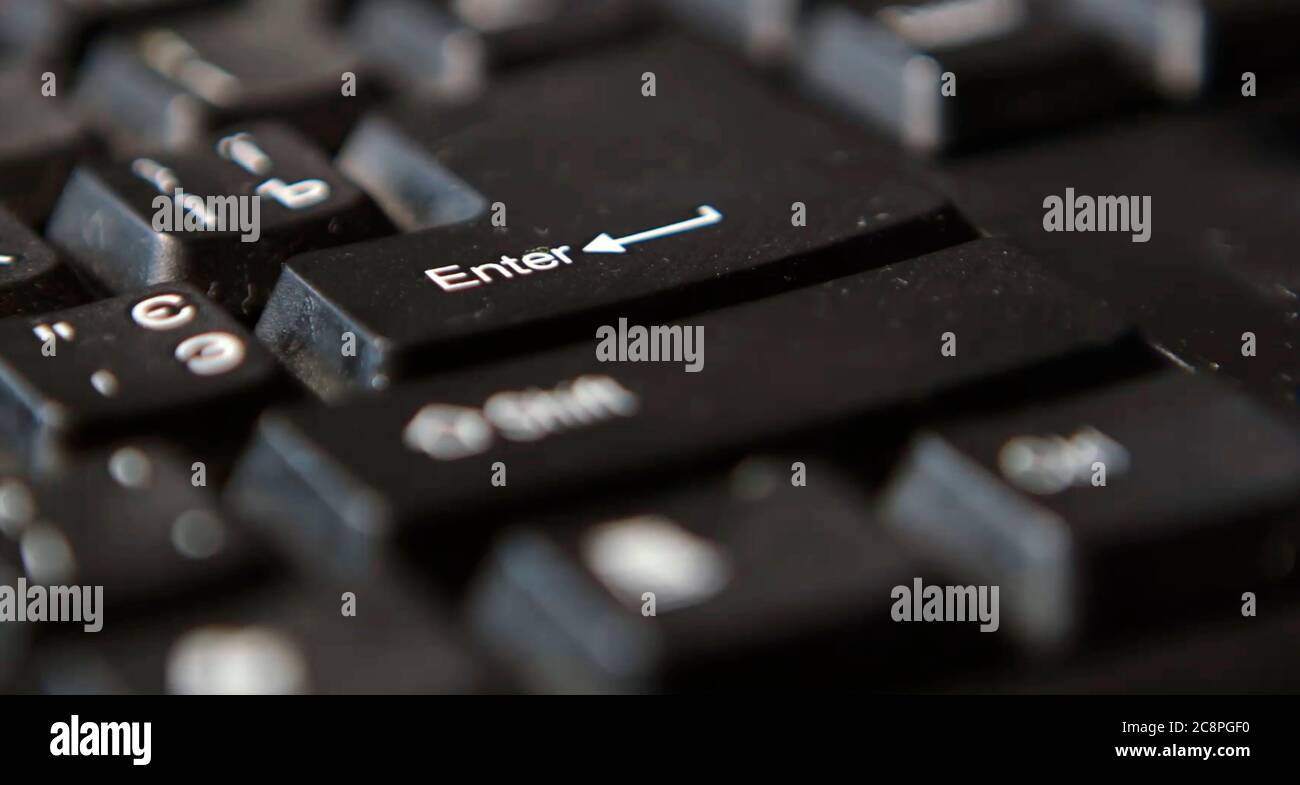 Black computer keyboard super close up stock footage. Black computer enter keys Stock Photo