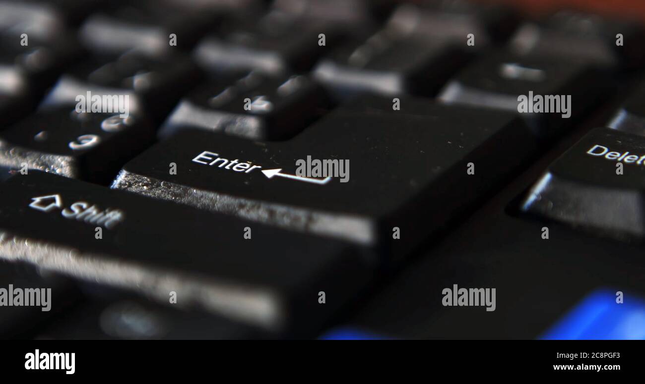 Black computer keyboard super close up stock footage. Black computer enter keys Stock Photo