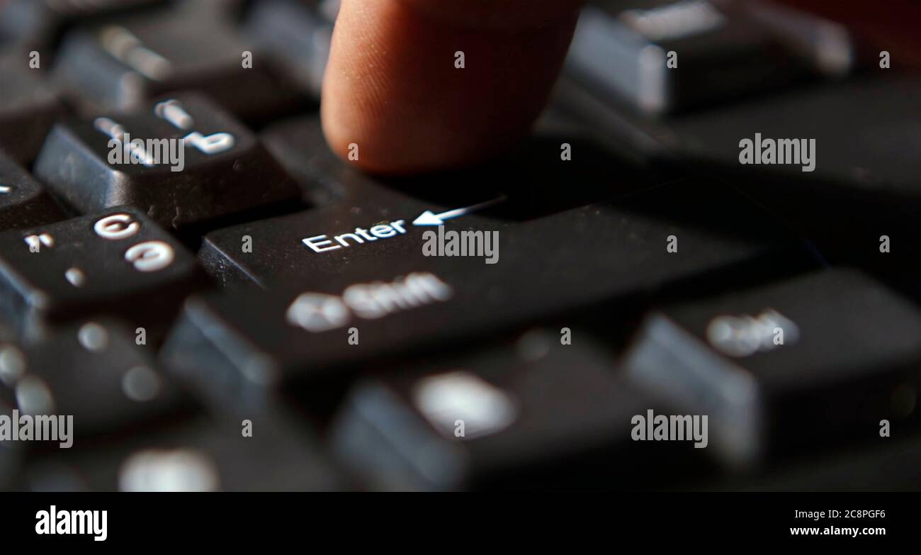 Black computer keyboard super close up stock footage. Black computer enter keys Stock Photo