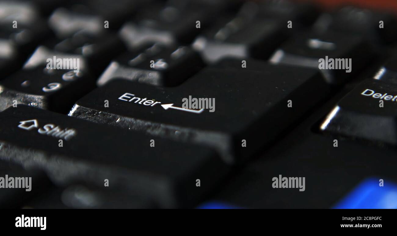 Black computer keyboard super close up stock footage. Black computer enter keys Stock Photo