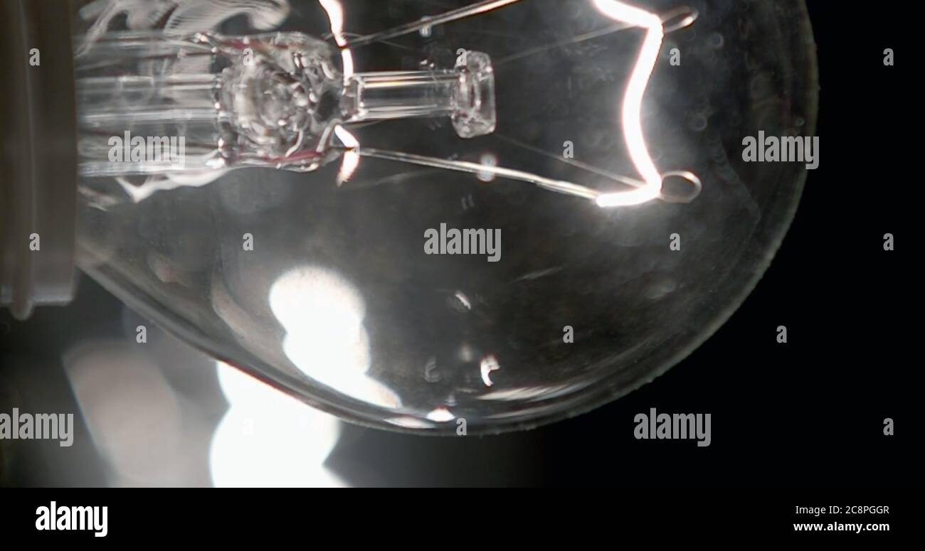 On a black background, incandescent filament tungsten lamps Stock Photo Alamy